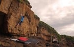 James Squire about to pull into the crux move on 'The Highwayman' at Ladye Bay, Clevedon.