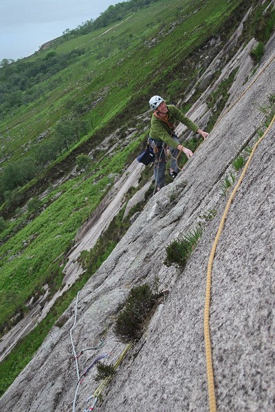 Neil following the rising traverse above the roof on pitch 3  © Clare Reading