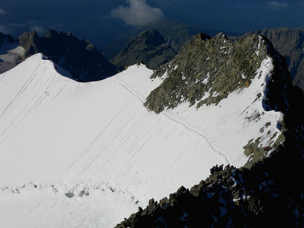 Descending the summit ridge of Piz Bernina  © amswanston