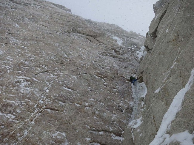 Nick Bullock on the classic steep ice pitch of the corner, with the big granite wall on his left looking very Scottish!  © Andy Houseman