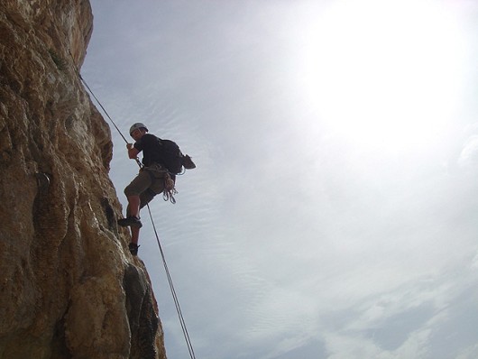 Martin Woolley abseiling from the cave on  Diedro UBSA, Penon de Ifach  © mdwoolley