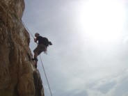Martin Woolley abseiling from the cave on  Diedro UBSA, Penon de Ifach