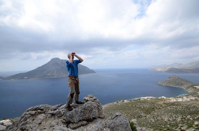 Mick Ryan using the Brunton Echo Spotting Scope to check out holds on a climb at Kalymnos, Greece  © UKC Gear