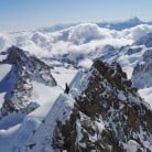Traversing the summit of the Aiguille du Chardonnet after climbing the South couloir.