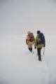 Will and Cav trudging across Pen Y Ole Wen summit plateau in a whiteout!