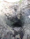Out of the stink and into the pink. Sit start in the cave entrance and follow the vertical crack.