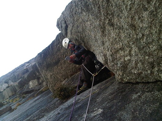 Trying to figure out the crux on Spartan Slab  © David Grierson