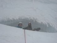 Brilliant sit down belay spot in snow cave immediately underneath big, solid cornice on Smith's route