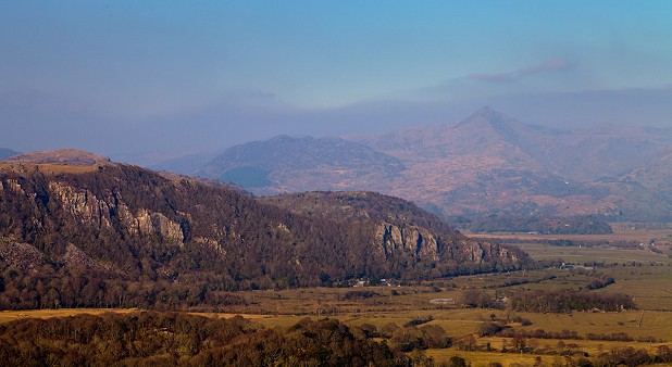 The cliffs and crags of Tremadog from Moel y Gest on a hazy afternoon  © David Dear