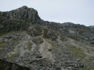 Find the climber descending from Dinas Cromlech