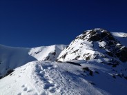 Approaching the top of ledge Route in fine February weather.