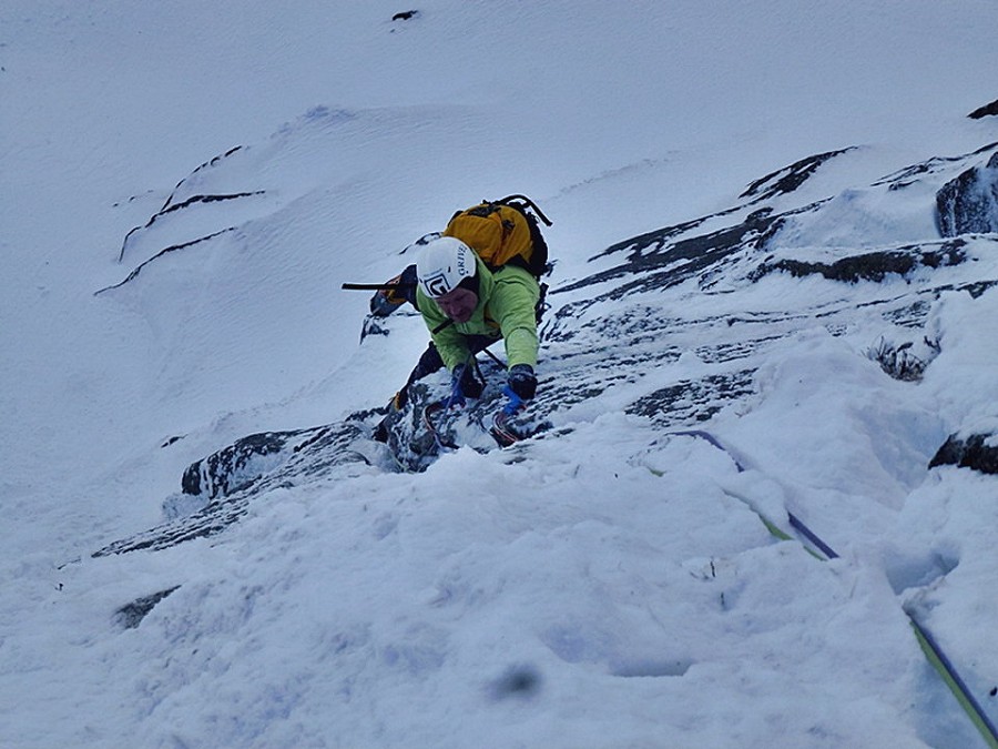 Guy pulling over the roof on pitch 2  © Nick Bullock