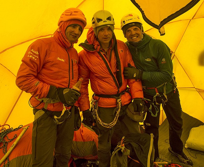 Ueli Steck, Jon Griffith and Simone Moro at camp 2. "We were told to put on our helmets, pack our bags, and run."  © Jon Griffith