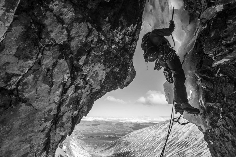 Mike Pescod pulls out of the cave on Ben Nevis’s Minus Three Gully in a prototype of the winter shell jacket.  © Jöttnar