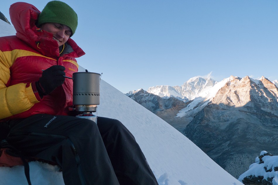 Rob on the bivvy as nightfall approaches. Everest in the background.  © Jack Geldard
