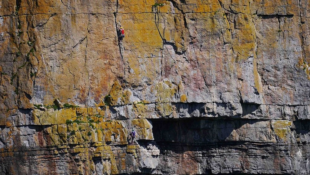 Tom Rogers ( Leading ) and Choire Horobin  on the alternative E1 Finish to Heart of Darkness, Mowing Word, Pembroke.  © WCC