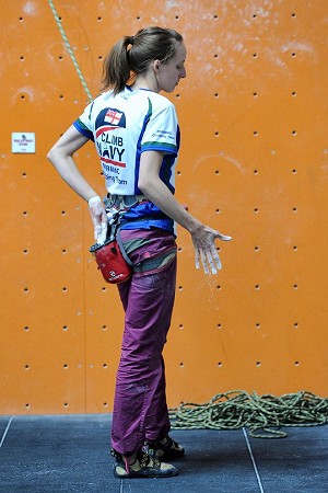 Lucy Matthews preparing herself for her lead climb to victory in the womens’ category  © MoD