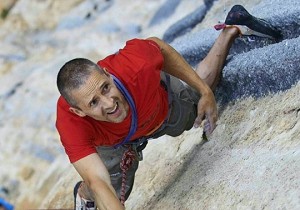 Steve McClure showing the strain of flashing a big endurance pitch with a storm approaching!  © Tim Glasby