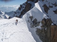 Hank traversing to first anchor of Whymper Couloir, followed by 15 abseils.