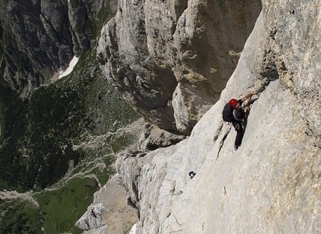 Looking down the South Face of the Marmolada at a Dutch pair on the crux of Don Quixote.   © James Rushforth