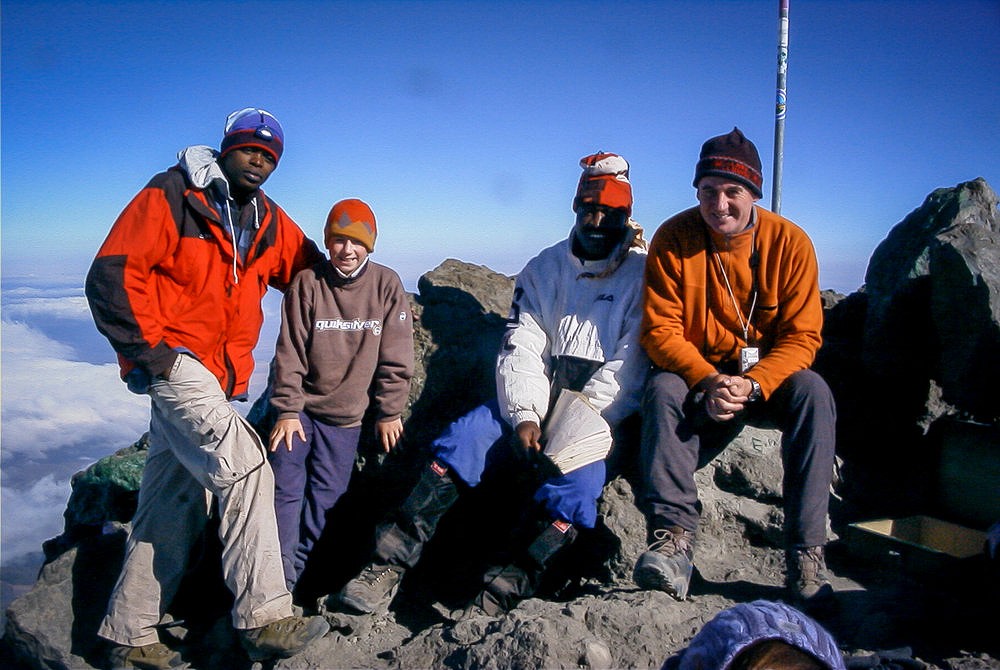 Dave and me with our trusty guide, Robinson Lyamuya, and park ranger on top of Mt Meru  © stevethex