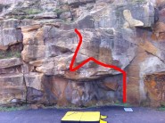Most challenging route of the area. Seated start feet on adjacent wall. Move left and then go for the slap and top out