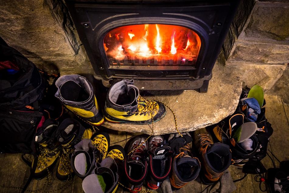 Drying boots after a long day in the winter hills  © Nadir Khan