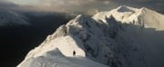 Chris approaching the pinnacles of the Aonach Eagach ridge, in spectacular winter condition.