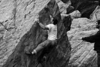 Climber david watson warming up on a V4 boulder