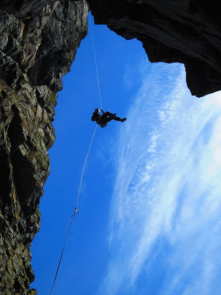 Ben Alsford on the wild 90m freehanging abseil into Grey Wall Recess  © Duncan Campbell