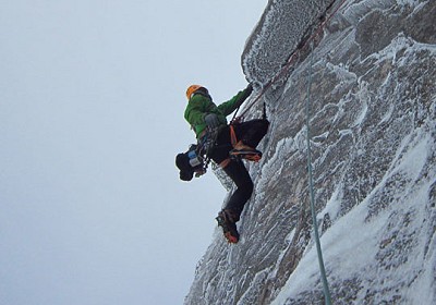 Murdoch pulling over the roof with just the crux of Hydroponicum to go on the FWA of The Route of All Evil, Beinn Eighe  © John Orr