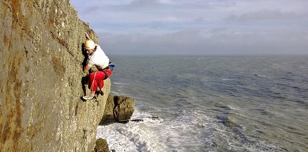 Benno topping out on the 3rd ascent of Melody, E8 6b, Lleyn Peninsula  © Calum Muskett