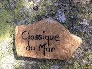 Names of most routes are painted on a small rock placed at bottom start of route like this Classique du mur