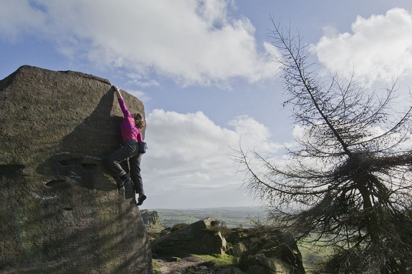Claire Carter on Joe's Arete (V3 6A) at the Roaches.  © Alan James
