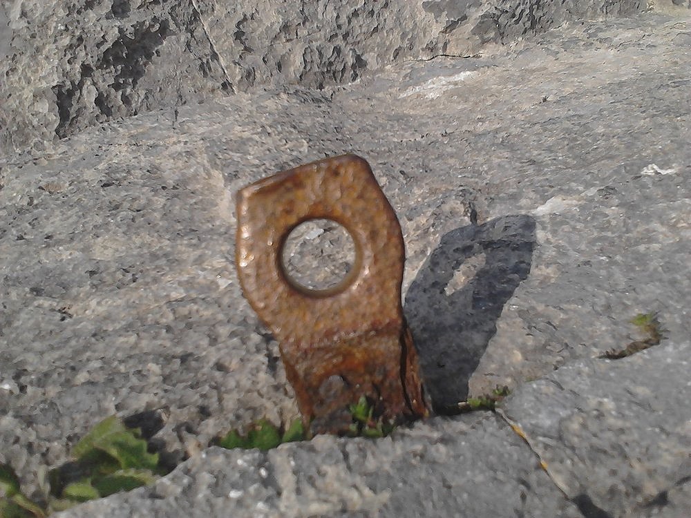 One of the two pegs on the belay ledges at the top of Little Tor  © pangeafoto