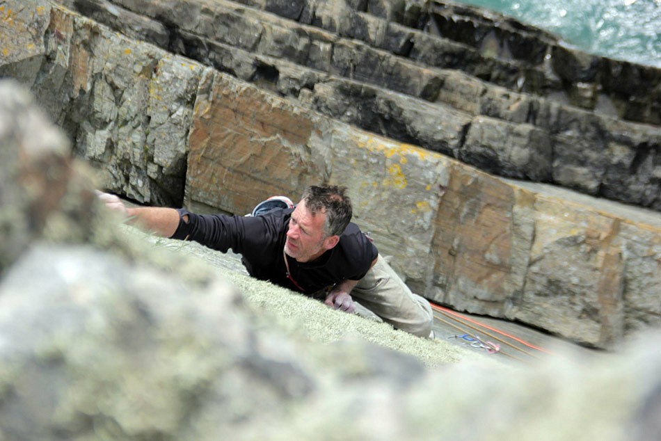 Dave Birkett on the final moves of Daddy Cool, E8 6b, Carreg-y-Barcud  © Guy Van Greuning