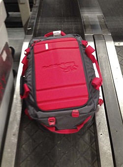 DMM Void Duffle - Disappearing down the normal conveyor at Manchester  © UKC Gear