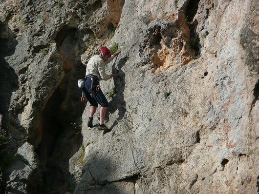 Dave on the slab section in the evening sun, Climber's Nest, 6a, Symplegades, Kalymnos.  © Dave Toseland