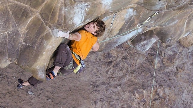 Robbie Phillips making the crux V10 traverse on the first ascent of Haggisaurus Rex, 8c, Coolum Cave  © Brenton Owens