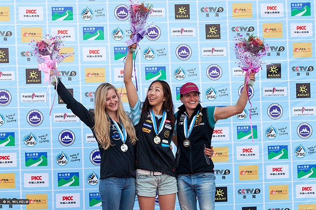 Shauna Coxsey on the podium having won Silver in Haiyang, 2014  © IFSC/Heiko Wilhelm