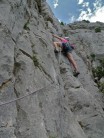 Fiona Thornewill enjoying the exposure nearing the top of Dalles Grise, Verdon, 5+