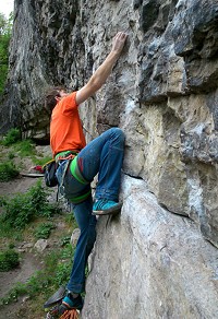 Outside member of staff James Turnbull warming up at Raven Tor before climbing Sardine using the adidas Solo Stealth  © Outside