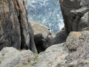 Climber Crossing Chock Stone at Chair Ladder