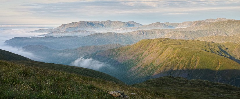 Wythburn Fells with Grasmere Common backed by Langdale Fells, taken on the way down following a wild camp up Helvellyn   © mikehike
