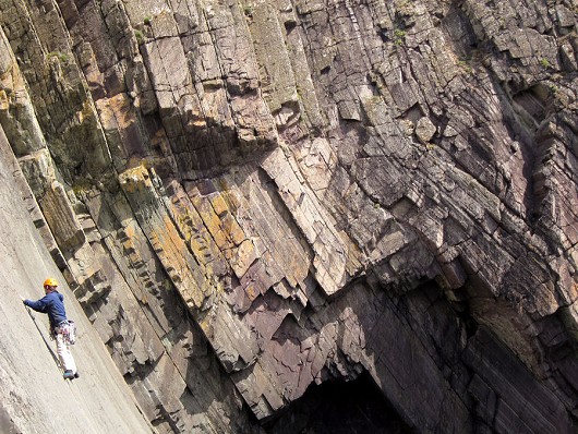 Slabtastic geology at Craig Caerfai, Pembrokeshire.  Unknown climber on 'Armorican'  © Stephen Bartle