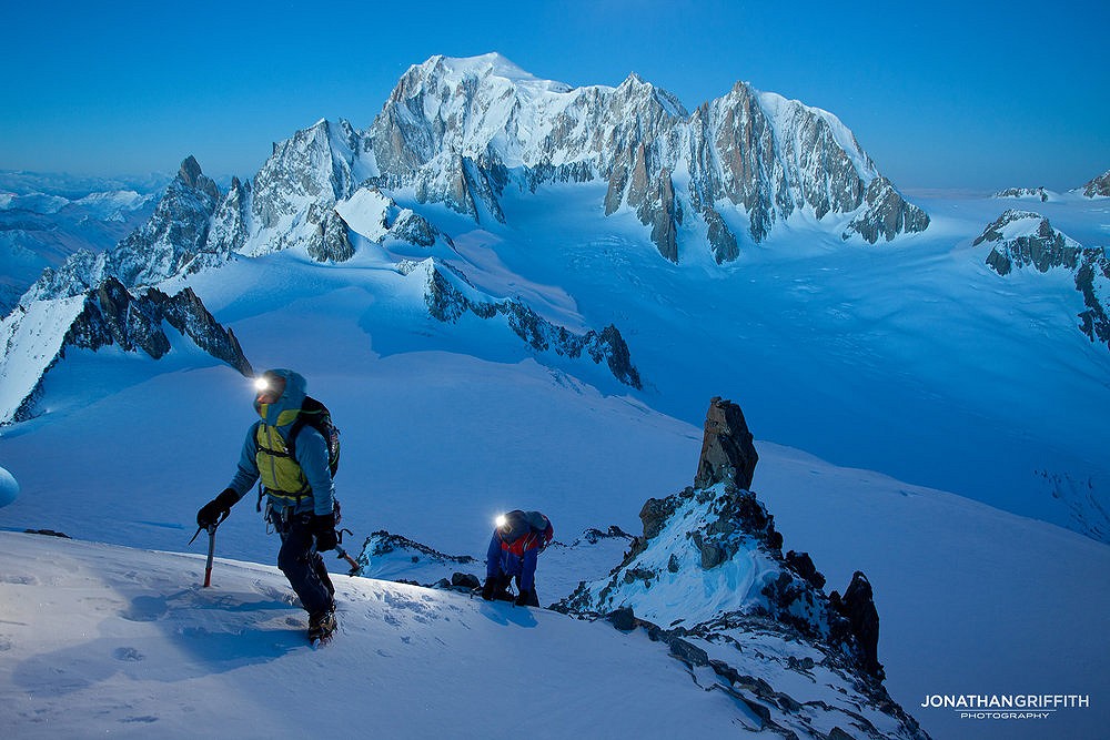 Philippe and Anna Gatta on the Rochefort arete under a full moon. Mont Blanc massif in the distance  © Jonathan Griffith