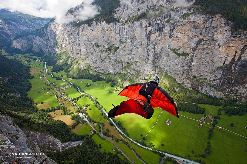 Jamie Flynn wingsuit flying in the Lauterbrunnen Valley, Switzerland.  © Jonathan Griffith