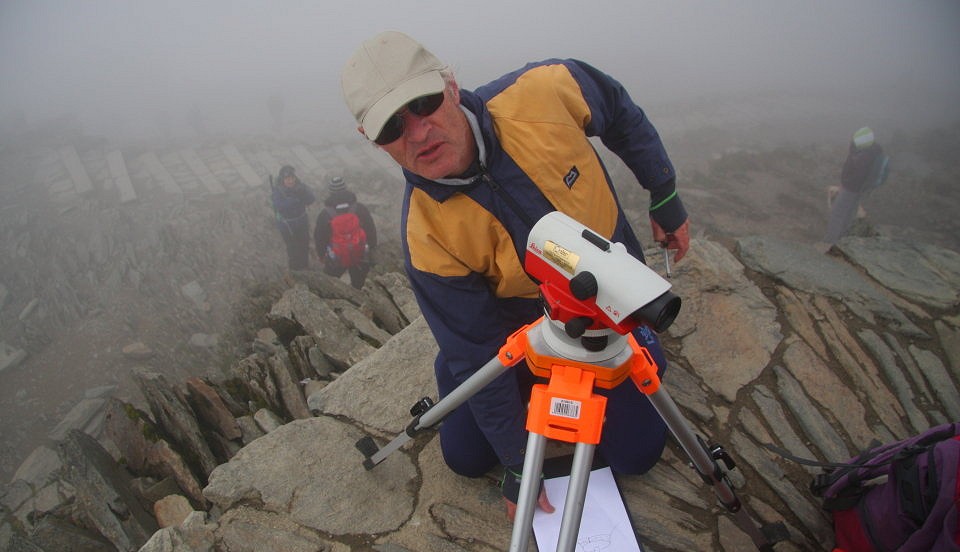 John with the level during reconnaissance of Snowdon summit  © G&J surveys