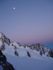 Dawn breaks over the Aig du Chardonet as moonlight fades from the Tour glacier