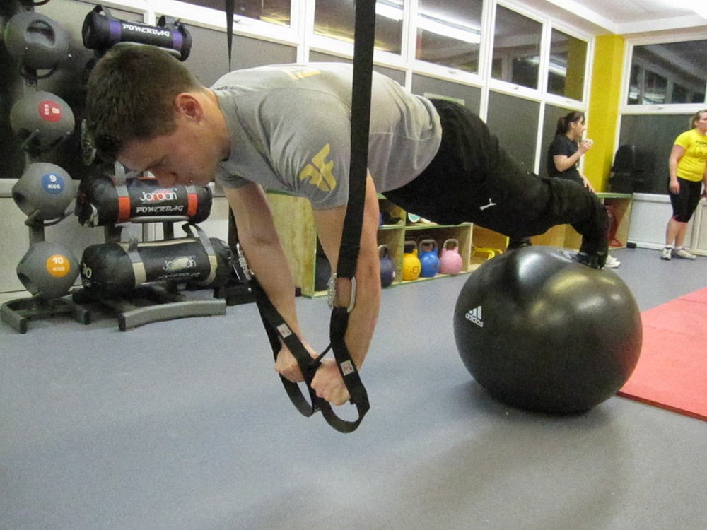 Front Plank straps and feet on ball advanced plus  © Functional Fitness Bristol Ltd